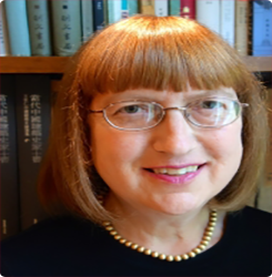 Headshot of Nancy S. Steinhardt In Front Of A Bookcase